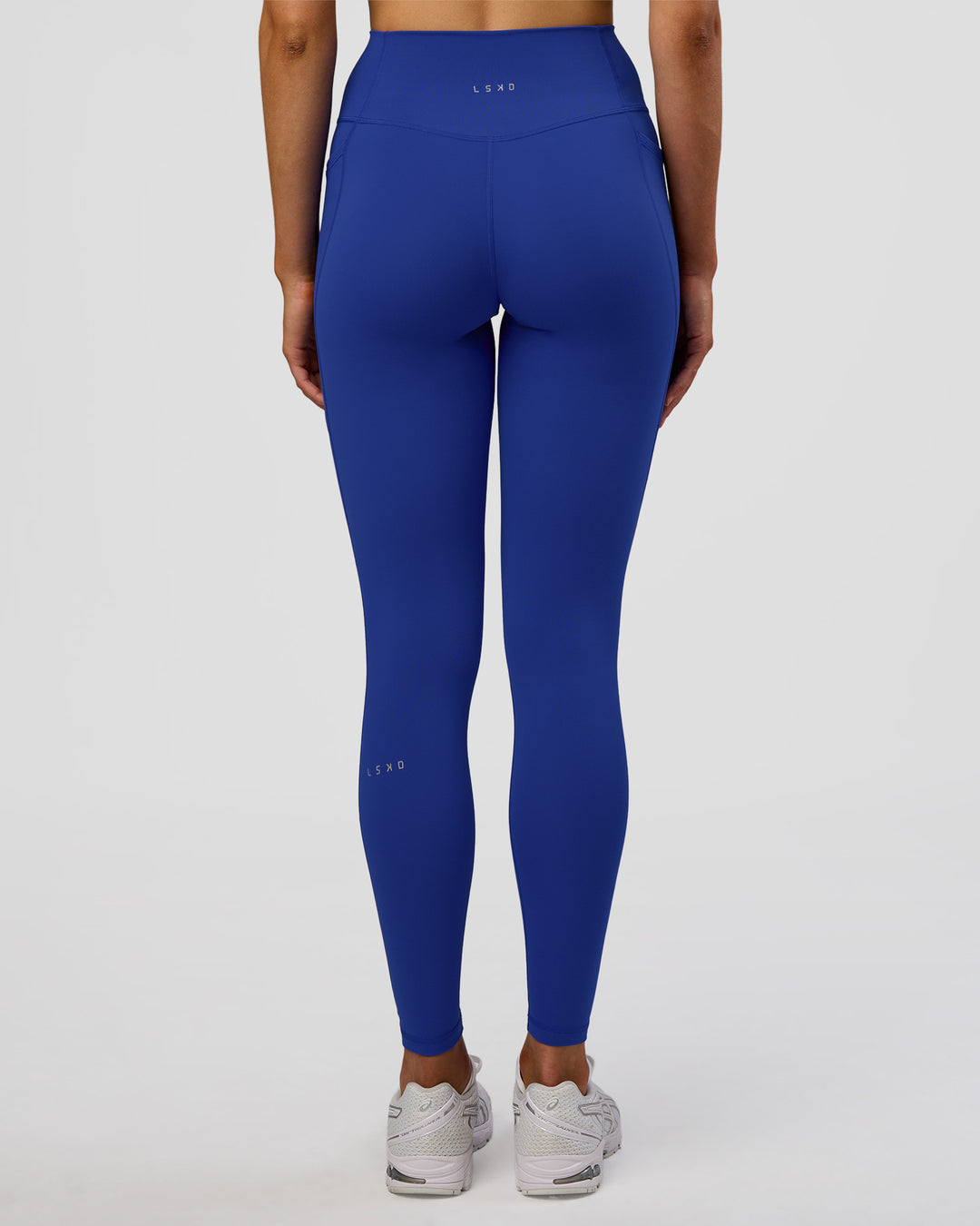 Woman wearing Fusion Ultra High-Rise Full Length Legging Pockets - Electric Indigo | Model:Evie | Size:S