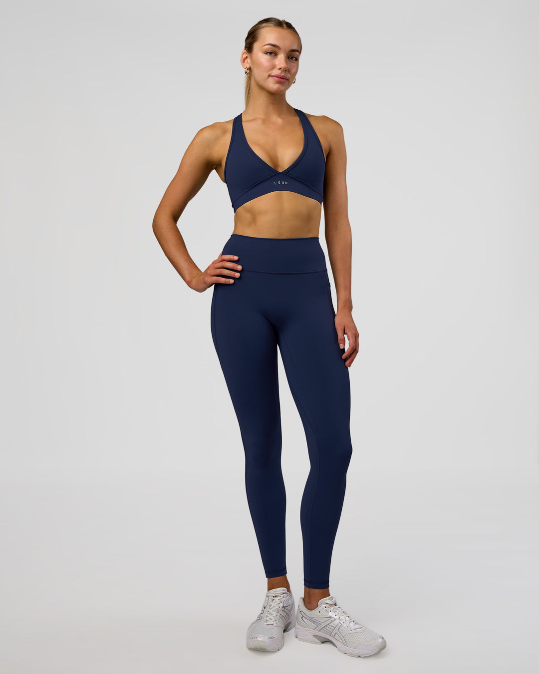 Woman wearing Fusion Ultra High-Rise Full Length Legging Pockets - Future Navy | Model:Evie | Size:S