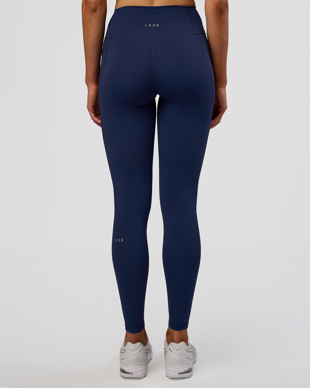 Woman wearing Fusion Ultra High-Rise Full Length Legging Pockets - Future Navy | Model:Evie | Size:S