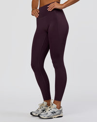 Woman wearing Fusion Ultra High-Rise Full Length Legging Pockets - Midnight Plum | Model:Amity | Size:S