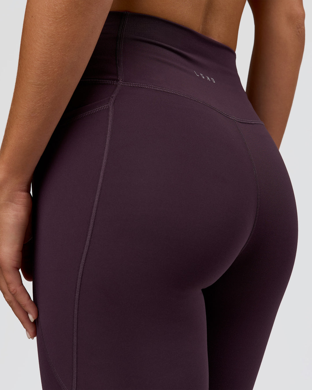 Woman wearing Fusion Ultra High-Rise Full Length Legging Pockets - Midnight Plum | Model:Amity | Size:S