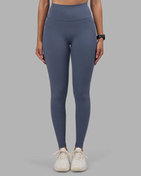 Woman wearing Fusion Ultra High-Rise Full Length Legging Pockets - Night Shadow | Model:Rhiley | Size:S