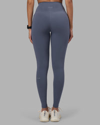 Woman wearing Fusion Ultra High-Rise Full Length Legging Pockets - Night Shadow | Model:Rhiley | Size:S