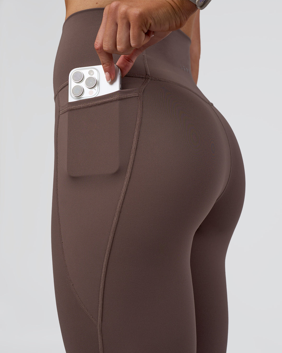 Woman wearing Fusion Ultra High-Rise Full Length Legging Pockets - Peppercorn | Model:Emelia | Size:S