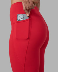 Woman wearing Fusion Ultra High-Rise Full Length Legging Pockets - Scarlet | Model:Sophie | Size:S