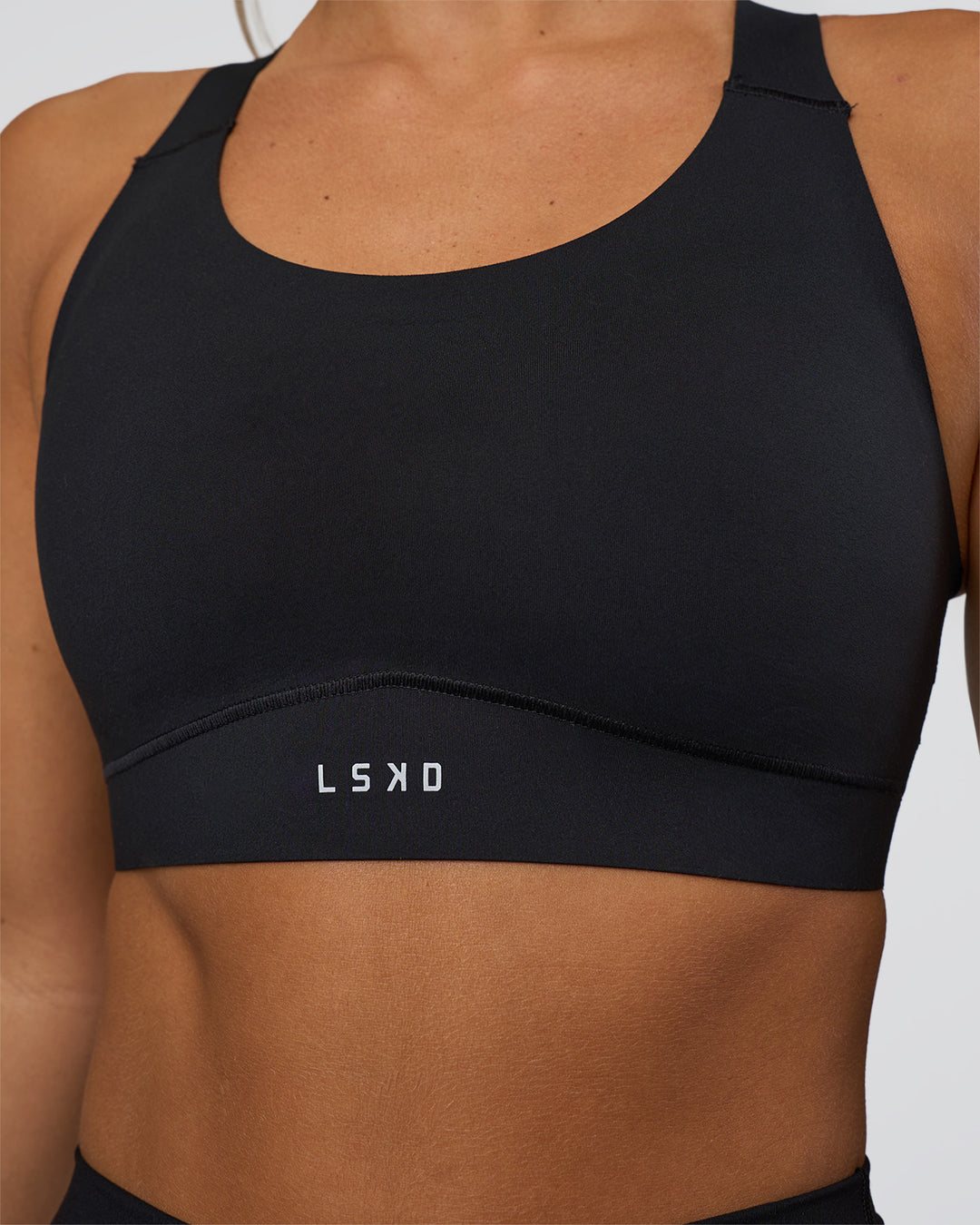 Woman wearing Fusion Sports Bra 2.0 - Black | Model:Amity | Size:S