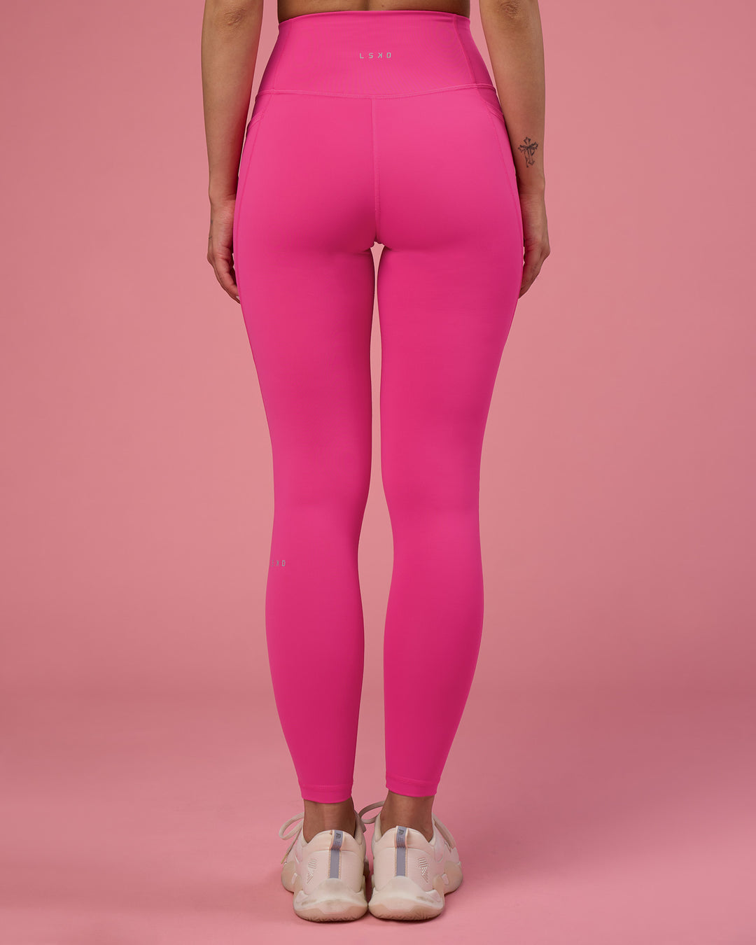 Woman wearing Fusion Ultra High-Rise Full Length Legging Pockets - Ultra Pink | Model:Tianah | Size:S