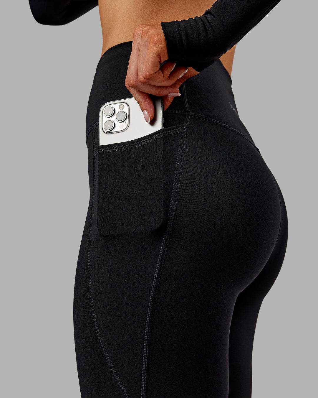 Woman wearing Fusion Ultra High-Rise Full Length Thermal Legging Pockets - Black | Model:Ella | Size:S