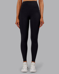 Woman wearing Fusion Ultra High-Rise Full Length Thermal Legging Pockets - Black | Model:Ella | Size:S