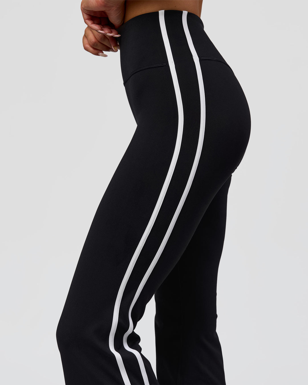 Woman wearing Fusion V-Contour Bind High-Rise Flared Legging - Black-white | Model:Bianca | Size:S
