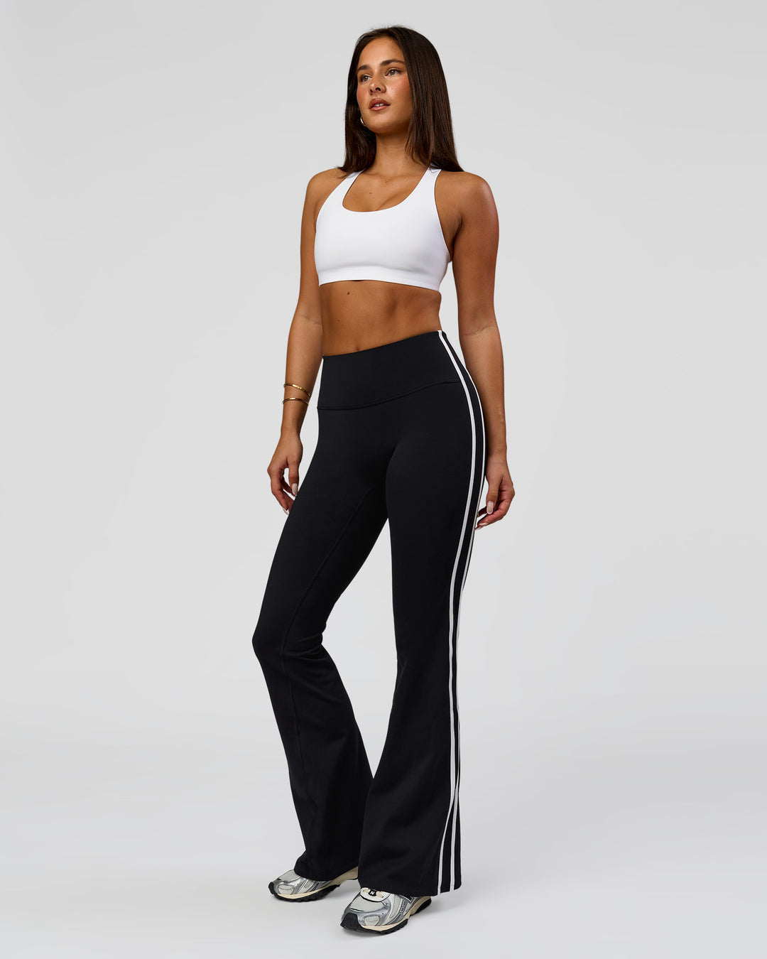 Woman wearing Fusion V-Contour Bind High-Rise Flared Legging - Black-white | Model:Bianca | Size:S