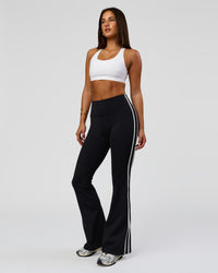 Woman wearing Fusion V-Contour Bind High-Rise Flared Legging - Black-white | Model:Bianca | Size:S