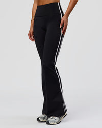 Woman wearing Fusion V-Contour Bind High-Rise Flared Legging - Black-white | Model:Bianca | Size:S