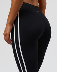 Woman wearing Fusion V-Contour Bind High-Rise Flared Legging - Black-white | Model:Bianca | Size:S