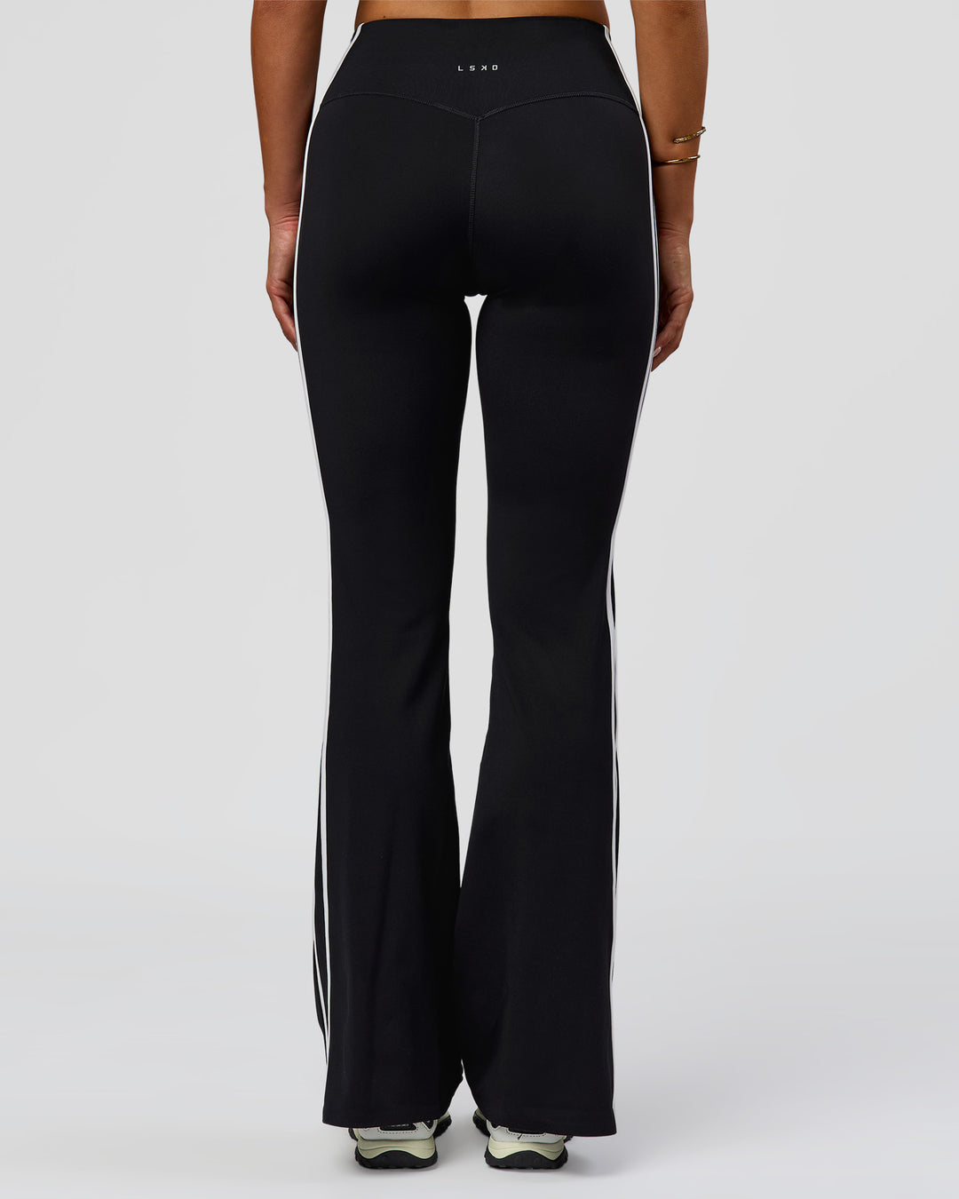 Woman wearing Fusion V-Contour Bind High-Rise Flared Legging - Black-white | Model:Bianca | Size:S