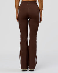 Woman wearing Fusion V-Contour Bind High-Rise Flared Legging - Hot Chocolate-white | Model:Bianca | Size:S