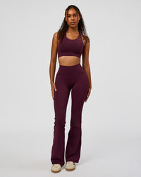 Woman wearing Fusion V-Contour High-Rise Flared Legging Pockets - Cherry Lacquer | Model:Jordan | Size:S