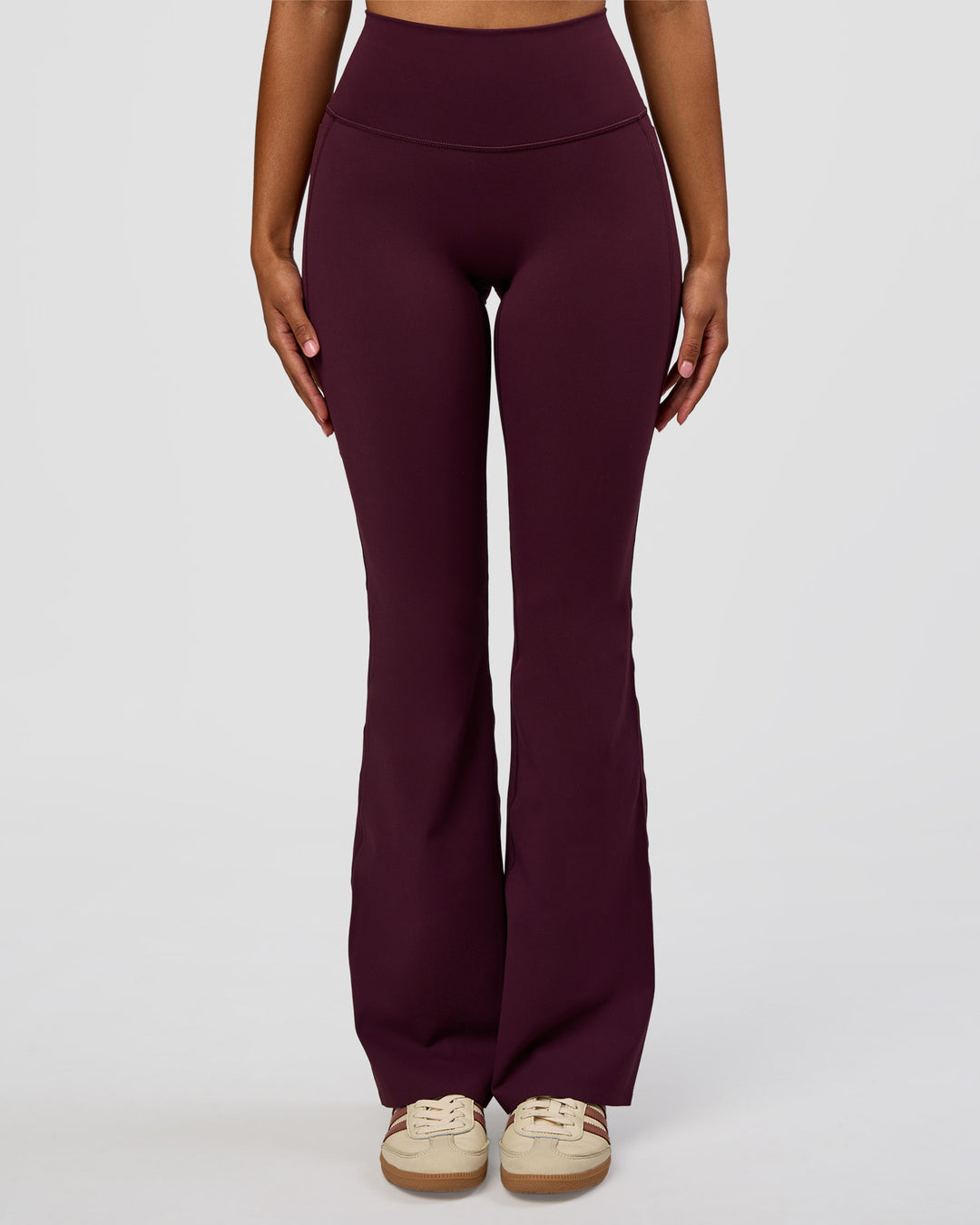 Woman wearing Fusion V-Contour High-Rise Flared Legging Pockets - Cherry Lacquer | Model:Jordan | Size:S