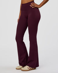 Woman wearing Fusion V-Contour High-Rise Flared Legging Pockets - Cherry Lacquer | Model:Jordan | Size:S