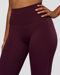 Woman wearing Fusion V-Contour High-Rise Flared Legging Pockets - Cherry Lacquer | Model:Jordan | Size:S