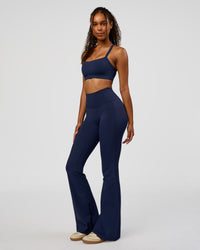 Woman wearing Fusion V-Contour High-Rise Flared Legging Pockets - Future Navy | Model:Jordan | Size:S