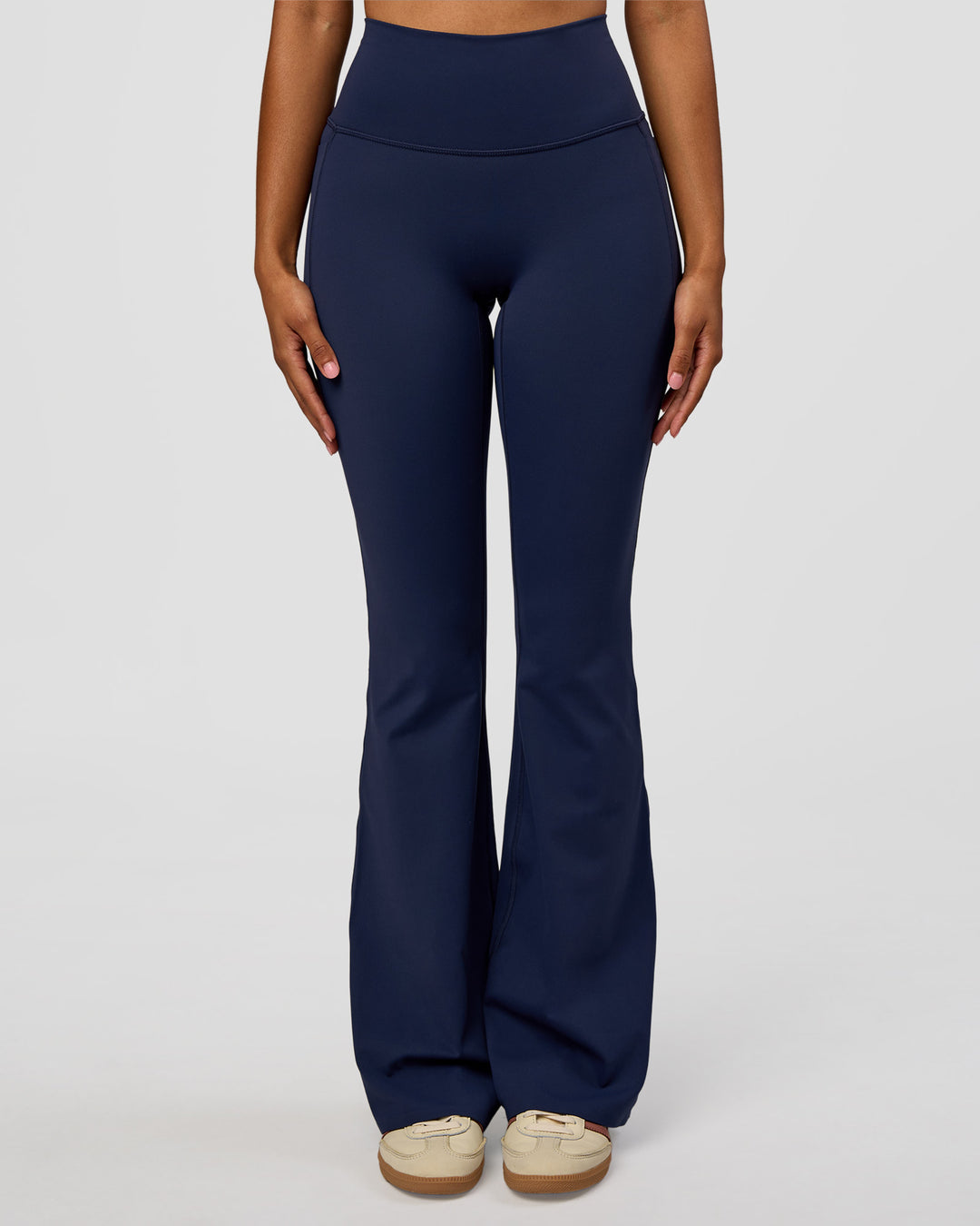 Woman wearing Fusion V-Contour High-Rise Flared Legging Pockets - Future Navy | Model:Jordan | Size:S
