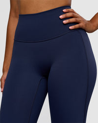 Woman wearing Fusion V-Contour High-Rise Flared Legging Pockets - Future Navy | Model:Jordan | Size:S