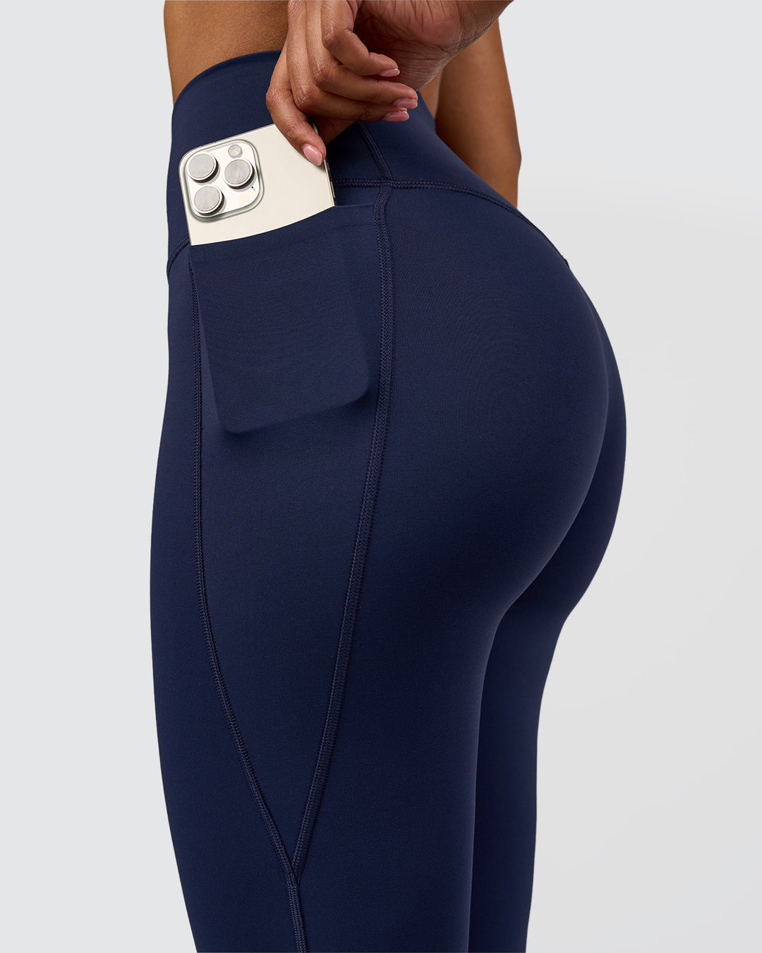 Woman wearing Fusion V-Contour High-Rise Flared Legging Pockets - Future Navy | Model:Jordan | Size:S