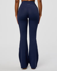 Woman wearing Fusion V-Contour High-Rise Flared Legging Pockets - Future Navy | Model:Jordan | Size:S