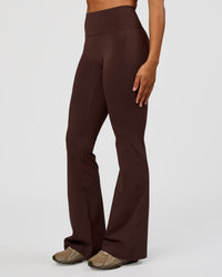 Woman wearing Fusion V-Contour High-Rise Flared Tall Legging Pockets - Hot Chocolate | Model:Rosie | Size:S