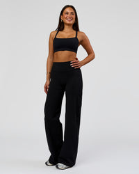 Woman wearing Fusion V-Contour High-Rise Pant - Black | Model:Bianca | Size:S