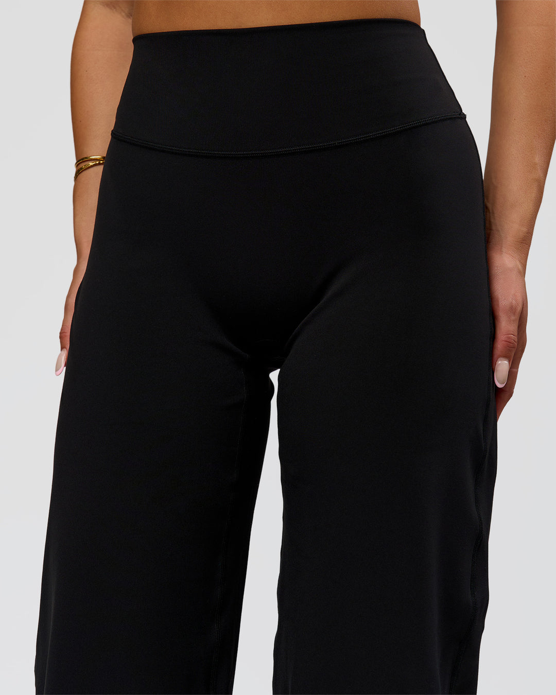 Woman wearing Fusion V-Contour High-Rise Pant - Black | Model:Bianca | Size:S