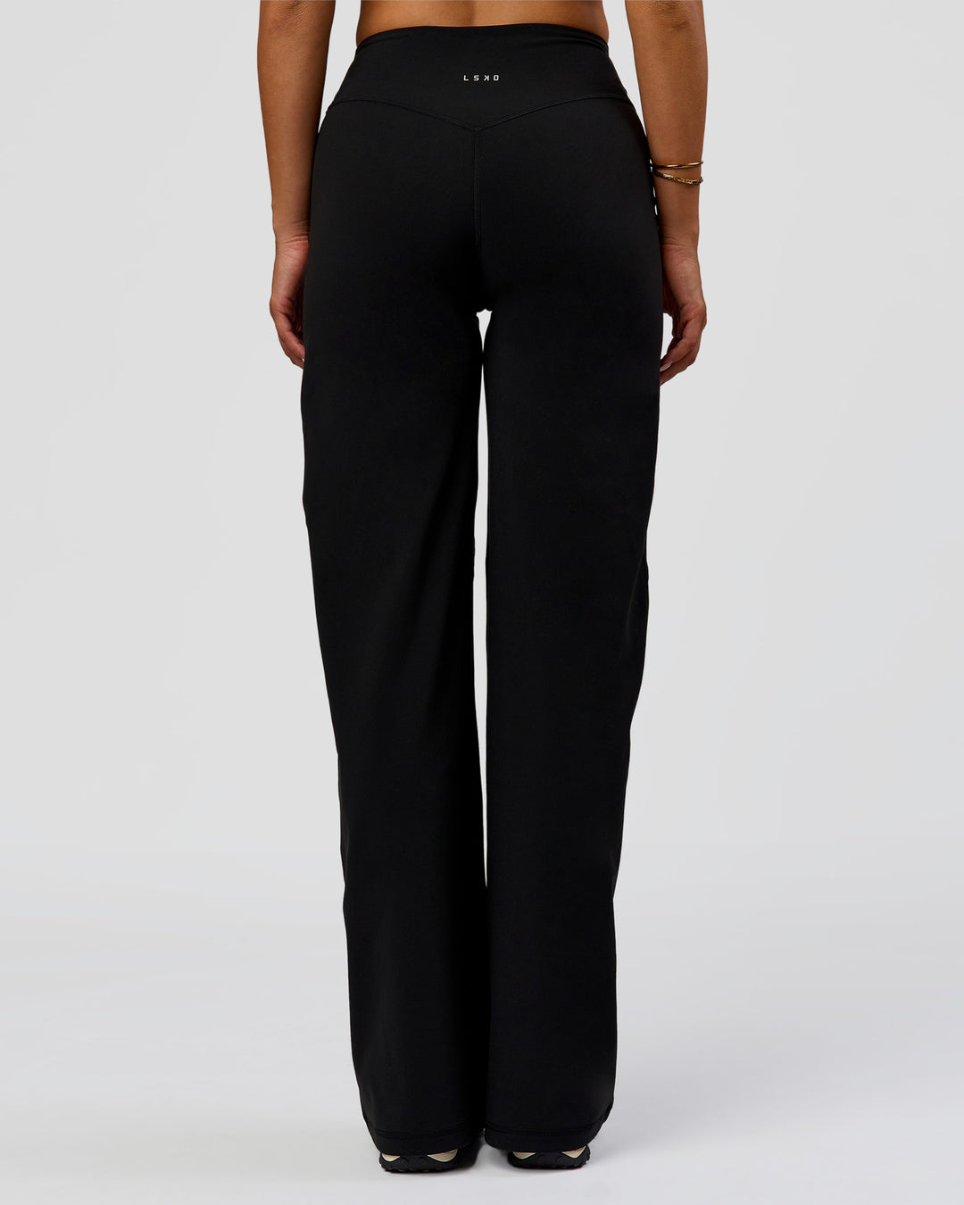 Woman wearing Fusion V-Contour High-Rise Pant - Black | Model:Bianca | Size:S
