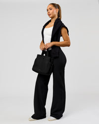 Woman wearing Fusion V-Contour High-Rise Tall Pant - Black | Model:Claire | Size:S