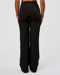 Woman wearing Fusion V-Contour High-Rise Tall Pant - Black | Model:Rosie | Size:S