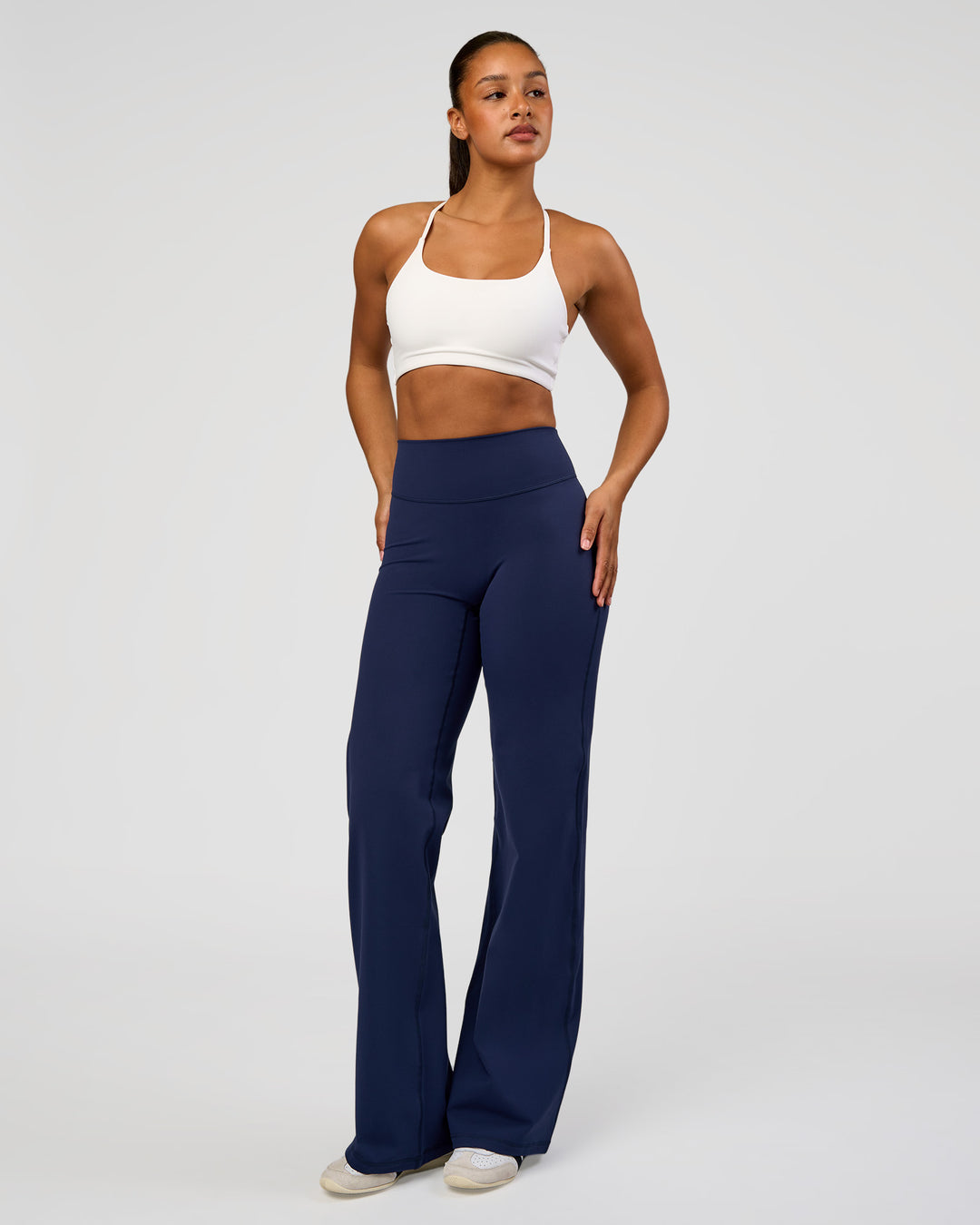 Woman wearing Fusion V-Contour High-Rise Tall Pant - Future Navy | Model:Rosie | Size:S
