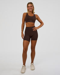 Woman wearing Fusion V-Contour Ultra High-Rise 6" Short Pockets - Hot Chocolate | Model:Amity | Size:S