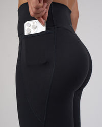 Woman wearing Fusion V-Contour Ultra High-Rise Full Length Legging Pockets - Black | Model:Charlize | Size:S