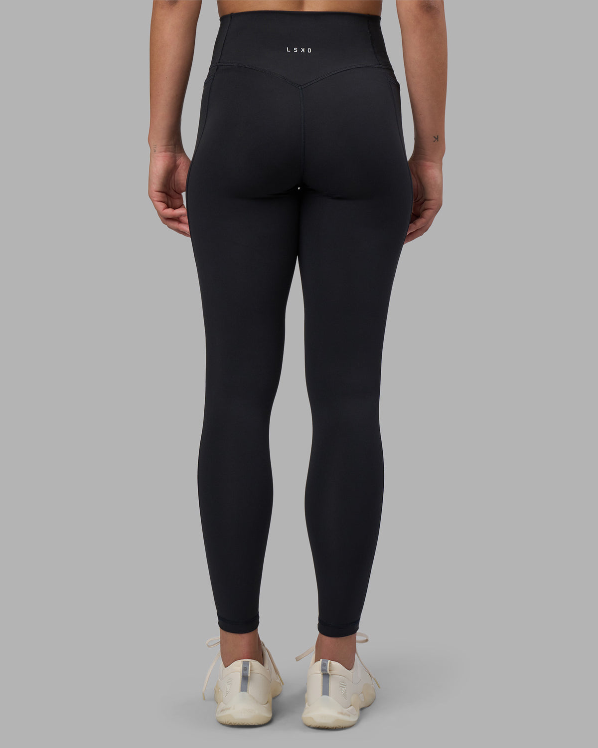 Woman wearing Fusion V-Contour Ultra High-Rise Full Length Legging Pockets - Black | Model:Charlize | Size:S - view 1