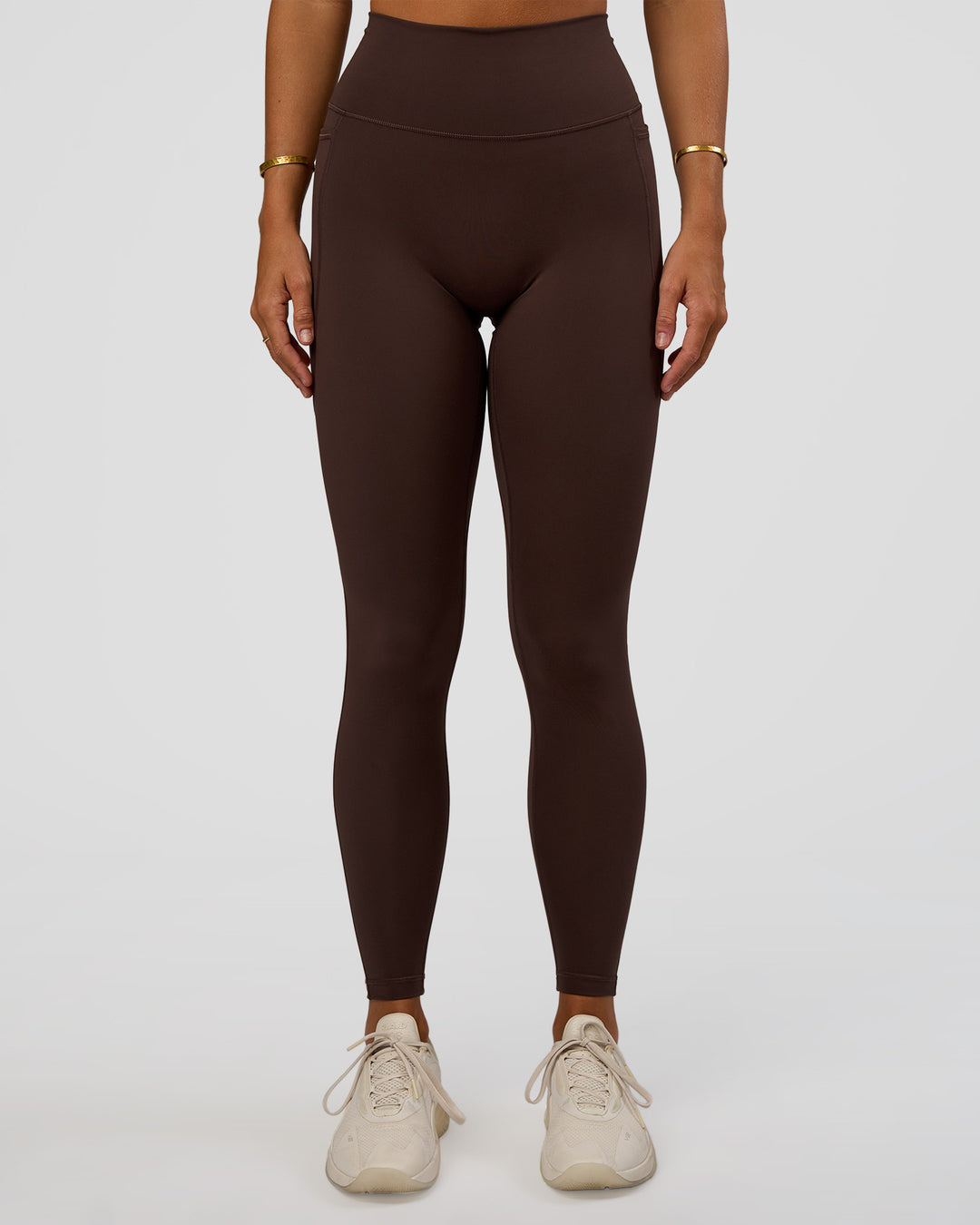 Woman wearing Fusion V-Contour Ultra High-Rise Full Length Legging Pockets - Hot Chocolate | Model:Amity | Size:S