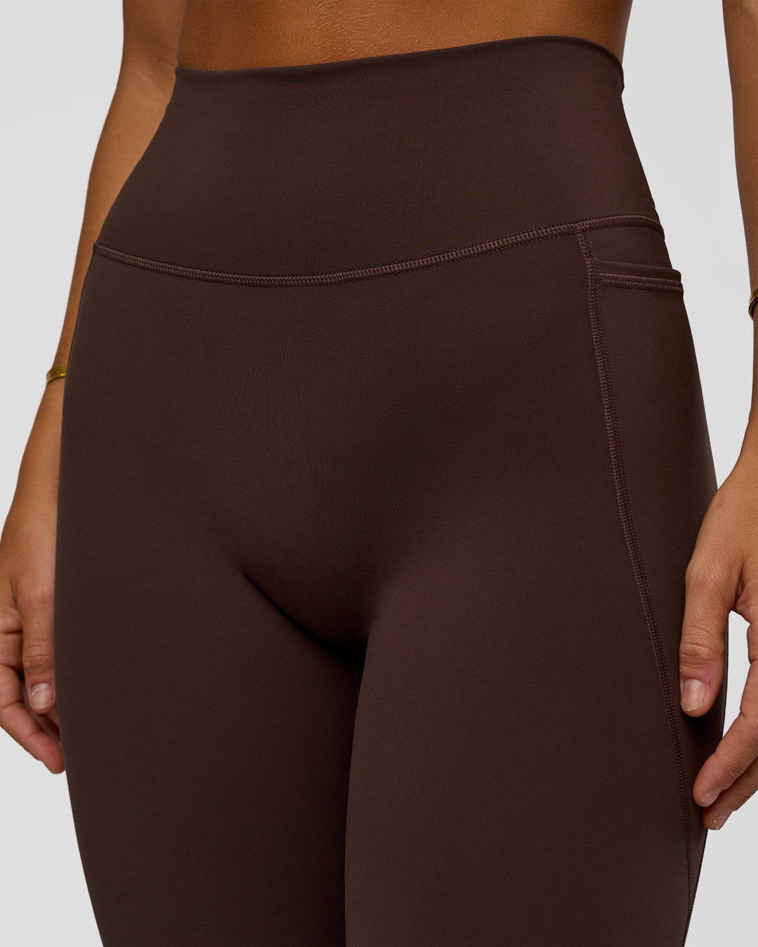 Woman wearing Fusion V-Contour Ultra High-Rise Full Length Legging Pockets - Hot Chocolate | Model:Amity | Size:S