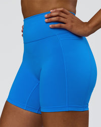 Woman wearing Fusion V-Contour Ultra High-Rise 6" Short Pockets - Palace Blue | Model:Rosie | Size:S