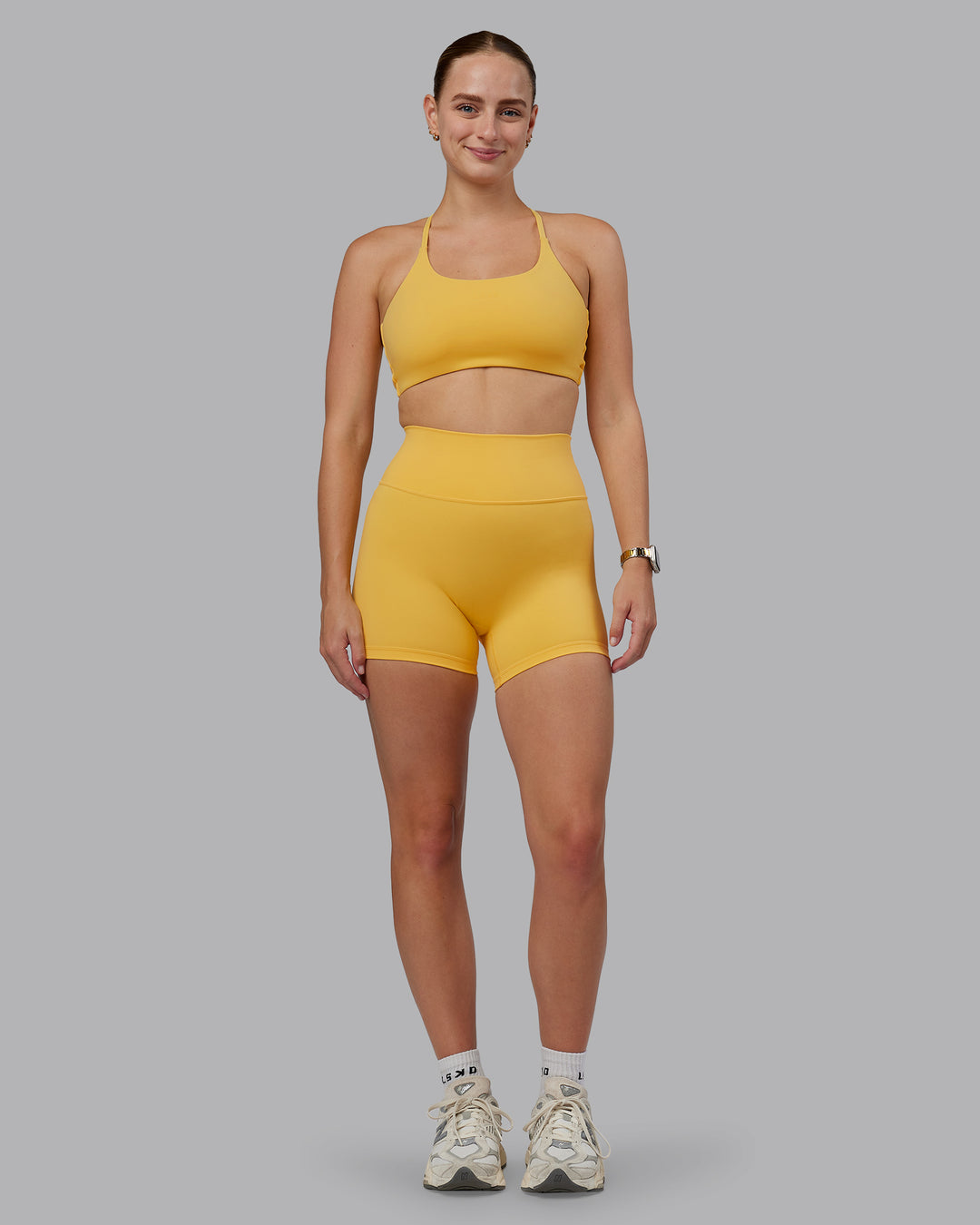 Woman wearing Fusion Ultra High-Rise 4&quot; Short - Banana Cream | Model:Lillie | Size:S