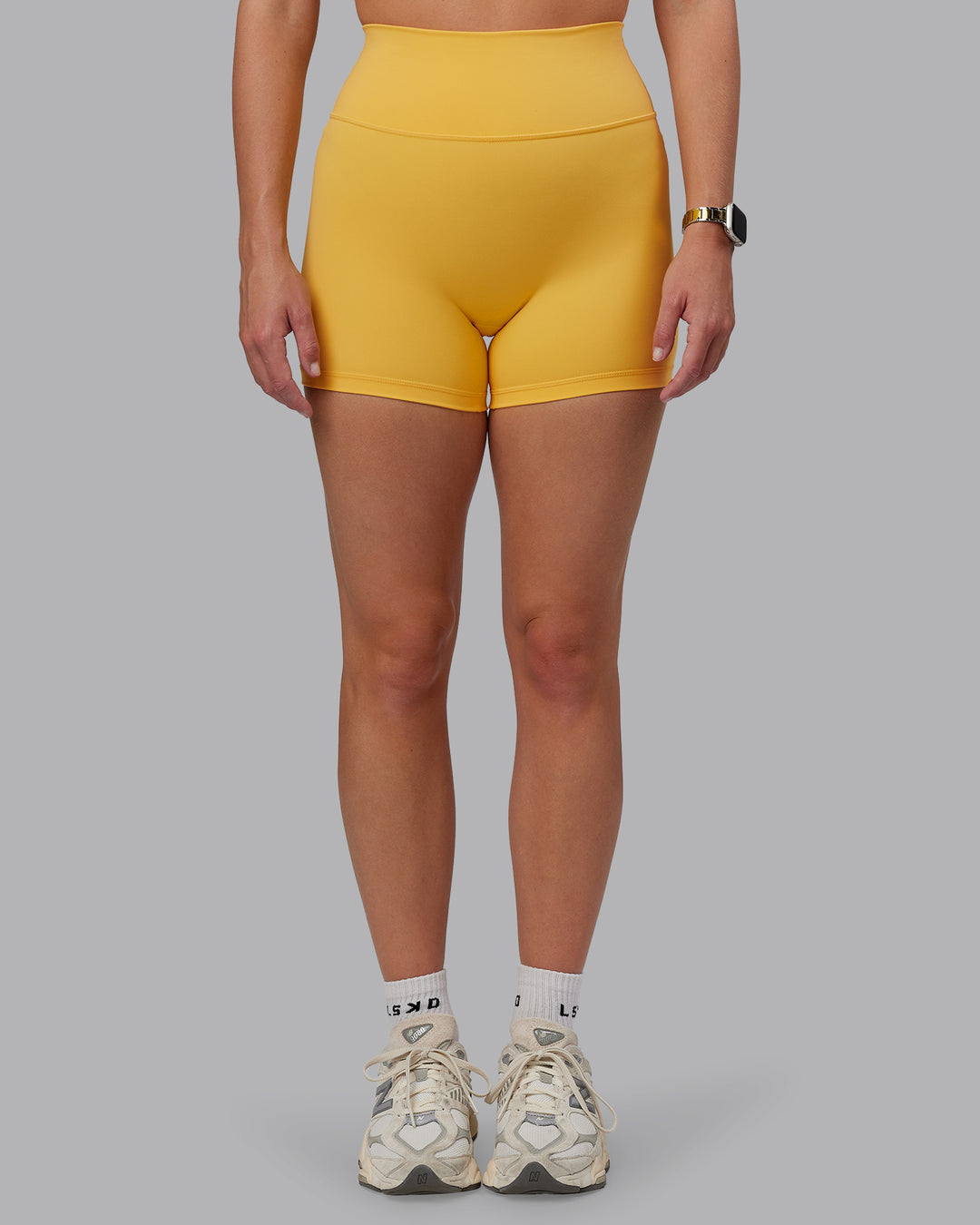Woman wearing Fusion Ultra High-Rise 4&quot; Short - Banana Cream | Model:Lillie | Size:S