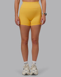 Woman wearing Fusion Ultra High-Rise 4" Short - Banana Cream | Model:Lillie | Size:S