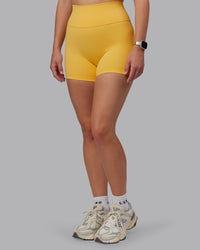 Woman wearing Fusion Ultra High-Rise 4" Short - Banana Cream | Model:Lillie | Size:S
