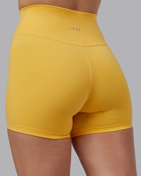 Woman wearing Fusion Ultra High-Rise 4" Short - Banana Cream | Model:Lillie | Size:S