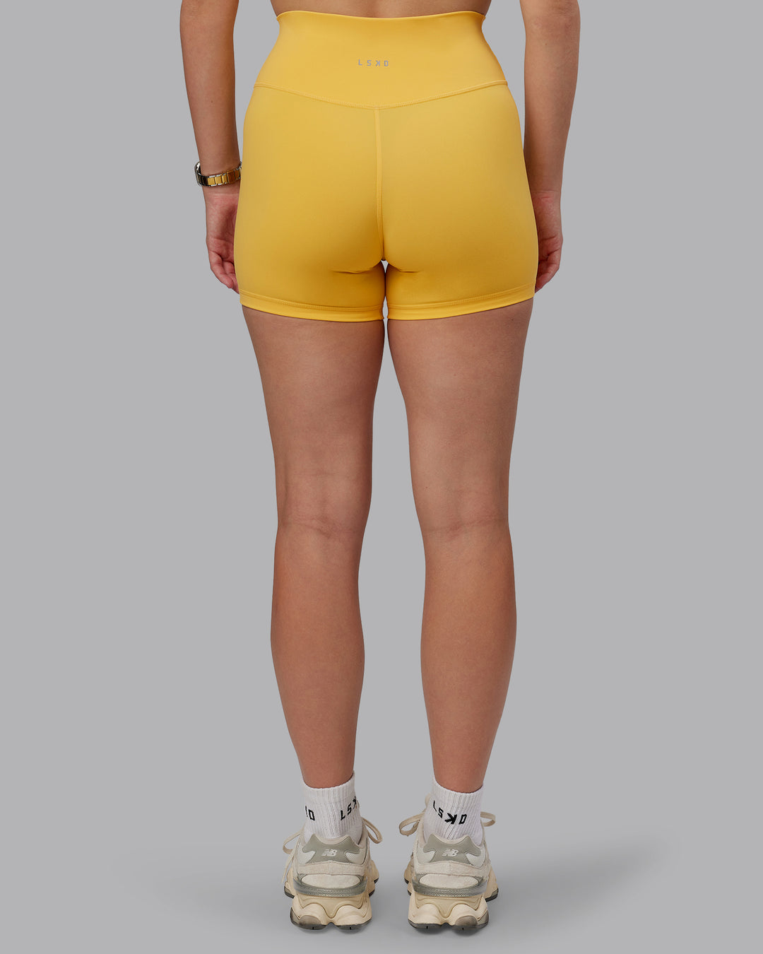 Woman wearing Fusion Ultra High-Rise 4&quot; Short - Banana Cream | Model:Lillie | Size:S