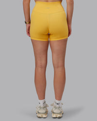 Woman wearing Fusion Ultra High-Rise 4" Short - Banana Cream | Model:Lillie | Size:S