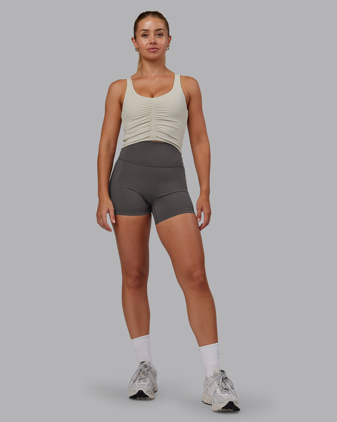 Woman wearing Fusion Ultra High-Rise 4&quot; Short - Dark Storm | Model:Hannah | Size:S
